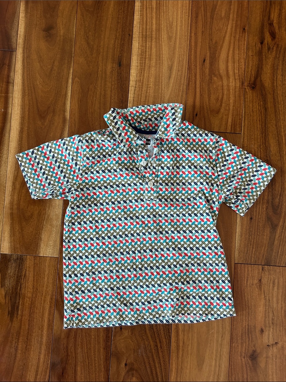 Tea Collection White Polo with Red, Blue, and Green Fish Print